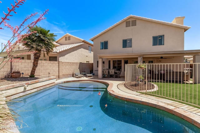 view of pool featuring a yard, a patio, fence, and a fenced in pool