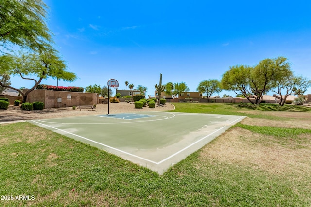 view of sport court with a lawn and community basketball court
