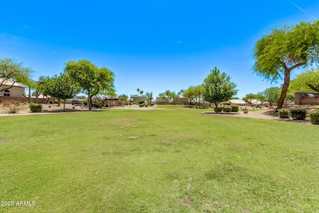 view of property's community with a lawn