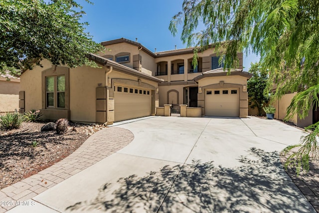 5437 W Red Bird Rd, Phoenix, AZ 85083 - mediterranean / spanish home with concrete driveway, an attached garage, and stucco siding
