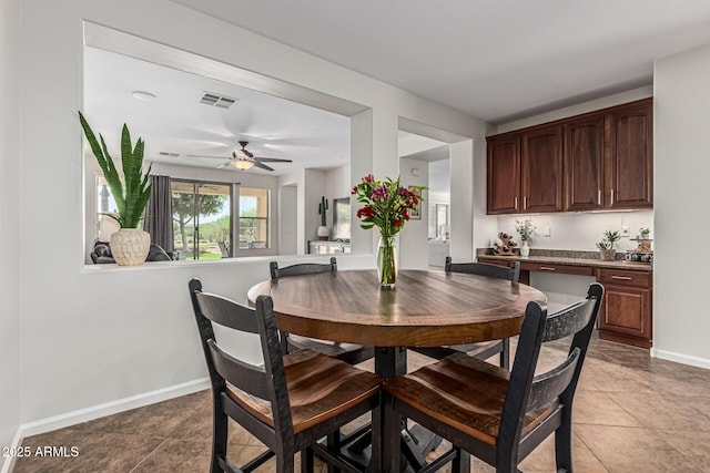 5437 W Red Bird Rd, Phoenix, AZ 85083 - dining room with light tile patterned flooring and ceiling fan