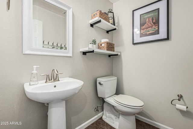 5437 W Red Bird Rd, Phoenix, AZ 85083 - half bathroom featuring baseboards and toilet