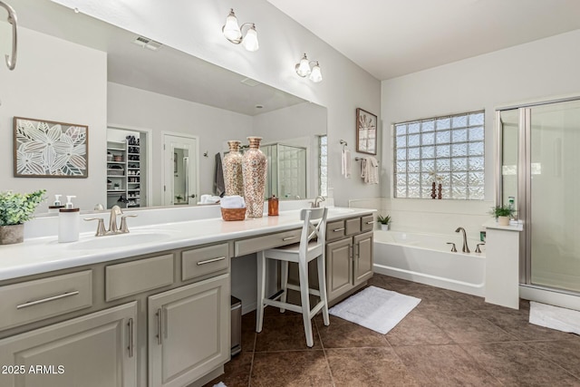 5437 W Red Bird Rd, Phoenix, AZ 85083 - full bath with double vanity, a stall shower, a bath, tile patterned floors, and a spacious closet