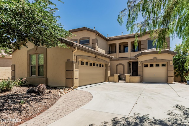 5437 W Red Bird Rd, Phoenix, AZ 85083 - mediterranean / spanish-style home featuring concrete driveway, stucco siding, and an attached garage