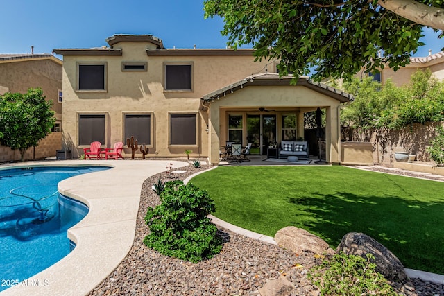 5437 W Red Bird Rd, Phoenix, AZ 85083 - back of property featuring a ceiling fan, a fenced backyard, stucco siding, and a patio