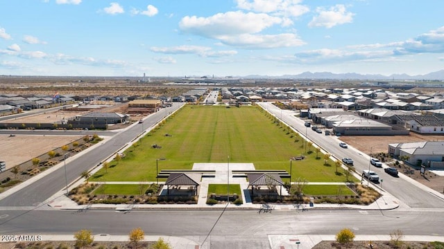 birds eye view of property with a mountain view