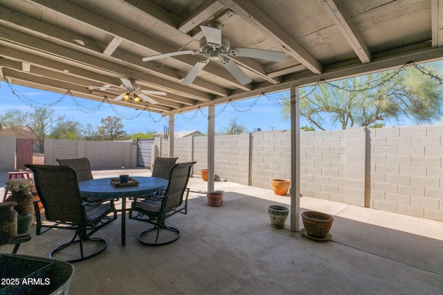 view of patio / terrace featuring outdoor dining space, ceiling fan, and a fenced backyard