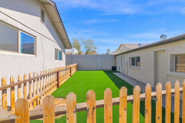 view of yard with a fenced backyard