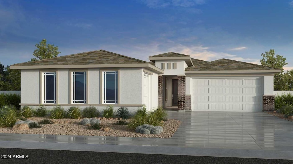 prairie-style home featuring a garage