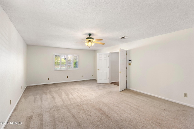 1017 E Grandview Rd, Phoenix, AZ 85022 - unfurnished room featuring light colored carpet, a ceiling fan, baseboards, and a textured ceiling