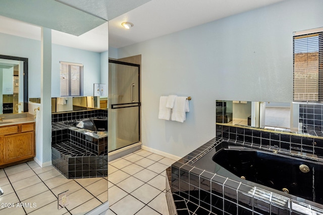 1017 E Grandview Rd, Phoenix, AZ 85022 - full bathroom featuring a tub with jets, vanity, a shower stall, tile patterned floors, and baseboards