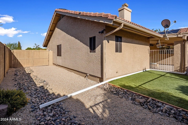 1017 E Grandview Rd, Phoenix, AZ 85022 - back of property featuring stucco siding, a chimney, a fenced backyard, a patio, and a tiled roof