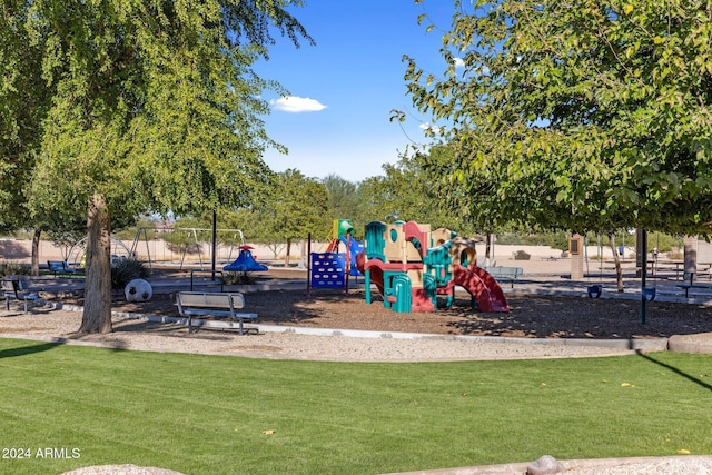 communal playground with a lawn