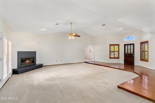 1017 E Grandview Rd, Phoenix, AZ 85022 - unfurnished living room featuring a glass covered fireplace, high vaulted ceiling, a ceiling fan, carpet flooring, and baseboards