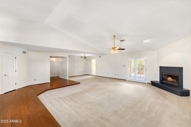 1017 E Grandview Rd, Phoenix, AZ 85022 - unfurnished living room with lofted ceiling, a glass covered fireplace, ceiling fan, wood finished floors, and baseboards