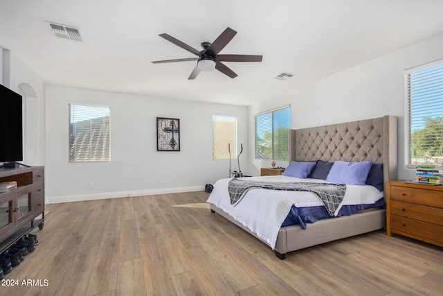 bedroom featuring light hardwood / wood-style floors and ceiling fan