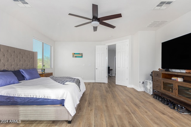 bedroom featuring wood-type flooring and ceiling fan