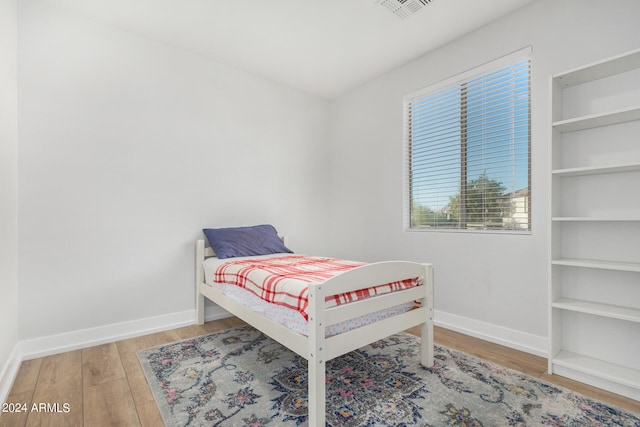 bedroom with light hardwood / wood-style flooring