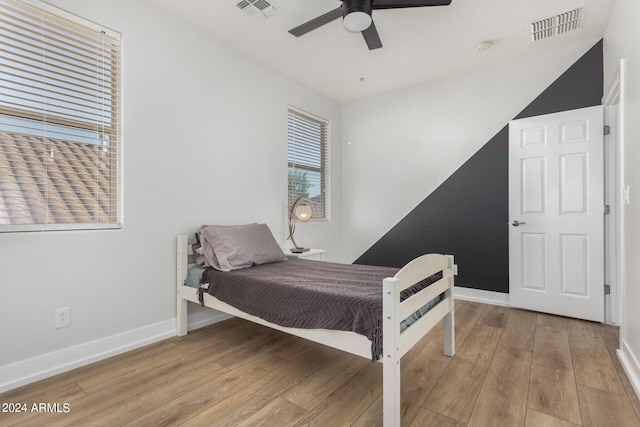 bedroom featuring light wood-type flooring and ceiling fan