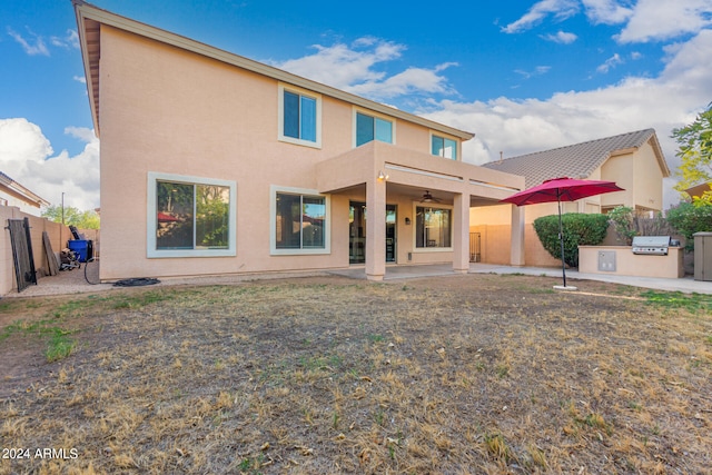 rear view of house with a patio