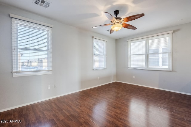 unfurnished room featuring dark hardwood / wood-style flooring and ceiling fan