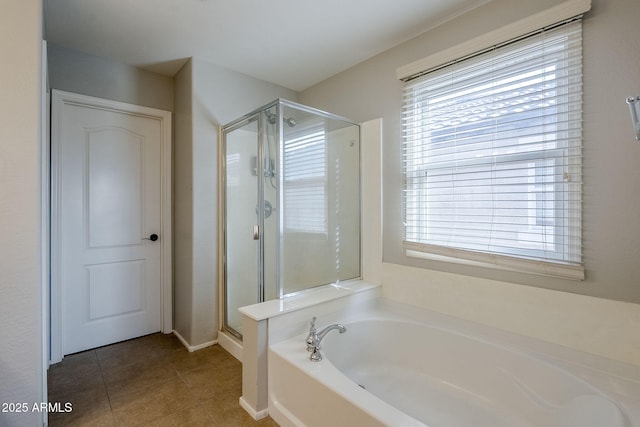 bathroom with tile patterned flooring and independent shower and bath