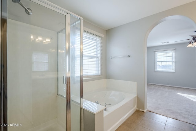 bathroom featuring tile patterned flooring, ceiling fan, and separate shower and tub