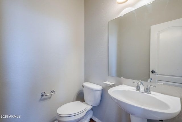 bathroom with toilet and sink