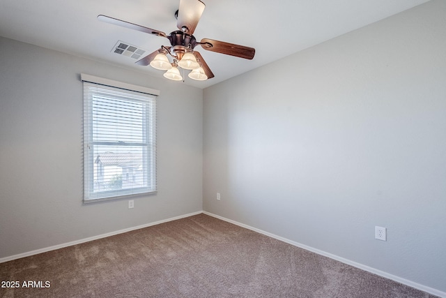 spare room with carpet floors and ceiling fan