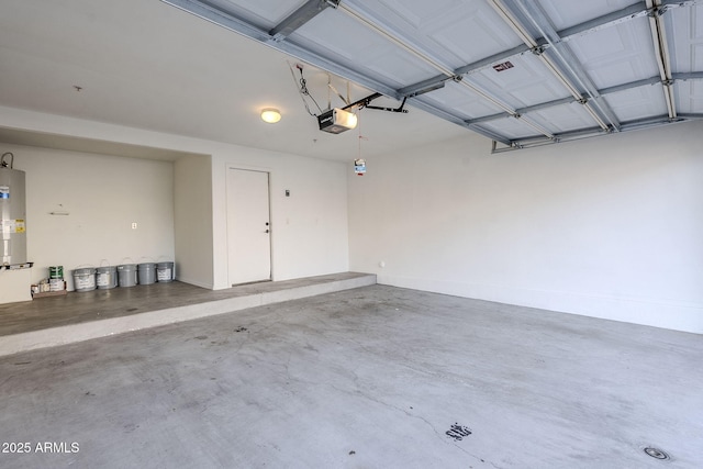 garage featuring electric water heater and a garage door opener