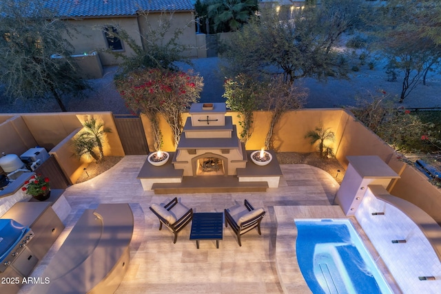 view of swimming pool featuring a patio area, a grill, a fenced backyard, and an outdoor living space with a fireplace