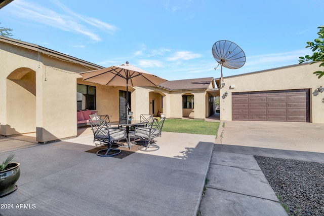 view of patio / terrace featuring a garage