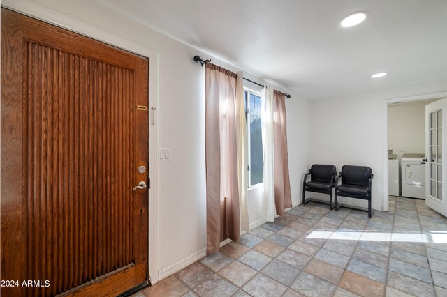 entrance foyer with french doors and washer and dryer