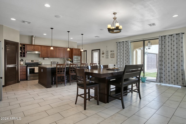 dining area featuring a chandelier