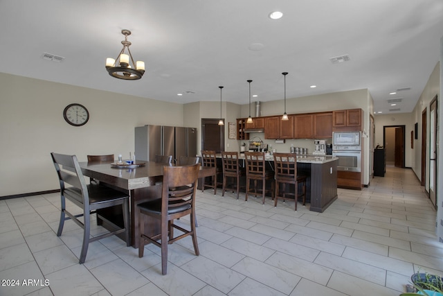 dining room featuring a notable chandelier