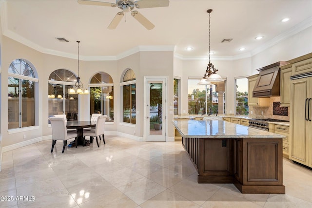 1507 E Treasure Cove Dr, Gilbert, AZ 85234 - kitchen featuring light stone countertops, visible vents, ornamental molding, and premium range hood