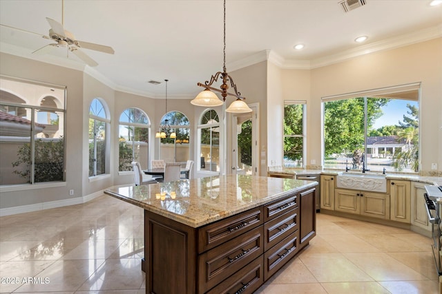 1507 E Treasure Cove Dr, Gilbert, AZ 85234 - kitchen featuring hanging light fixtures, visible vents, a sink, and light stone counters