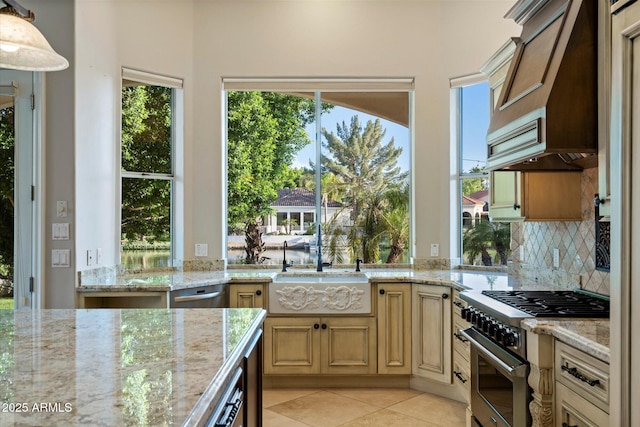 1507 E Treasure Cove Dr, Gilbert, AZ 85234 - kitchen with stainless steel appliances, light stone countertops, light tile patterned floors, and tasteful backsplash