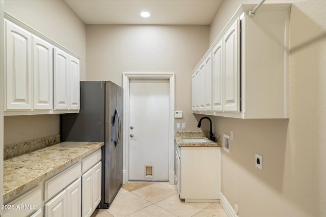 1507 E Treasure Cove Dr, Gilbert, AZ 85234 - clothes washing area featuring cabinet space, a sink, hookup for a washing machine, electric dryer hookup, and light tile patterned floors