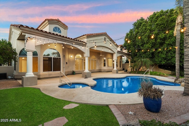 1507 E Treasure Cove Dr, Gilbert, AZ 85234 - back of house featuring a patio, stucco siding, a pool with connected hot tub, and a tiled roof