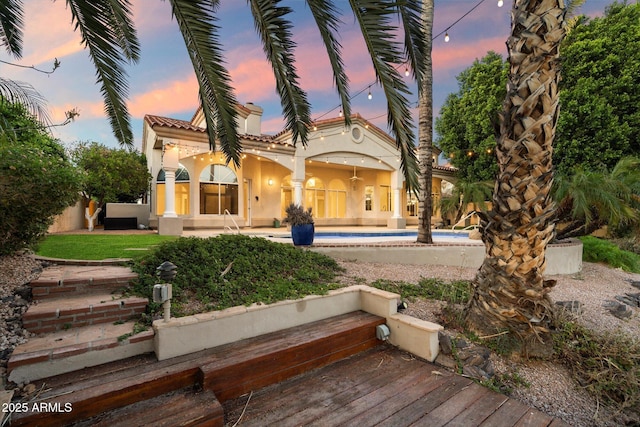 1507 E Treasure Cove Dr, Gilbert, AZ 85234 - rear view of property with a wooden deck, stucco siding, a tile roof, and an outdoor pool