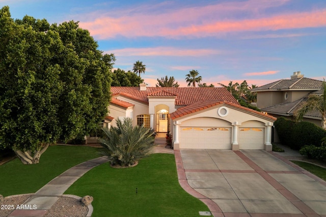 1507 E Treasure Cove Dr, Gilbert, AZ 85234 - mediterranean / spanish home featuring a tile roof, a garage, stucco siding, concrete driveway, and a lawn