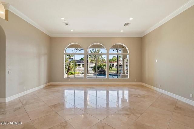 1507 E Treasure Cove Dr, Gilbert, AZ 85234 - empty room featuring crown molding, arched walkways, baseboards, and light tile patterned floors