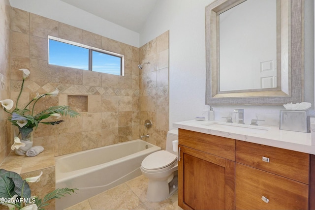 full bathroom with lofted ceiling, toilet, vanity, tiled shower / bath combo, and tile patterned flooring