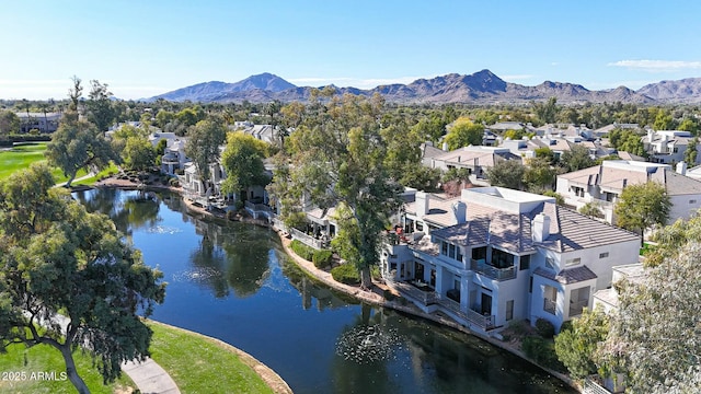 drone / aerial view with a water and mountain view