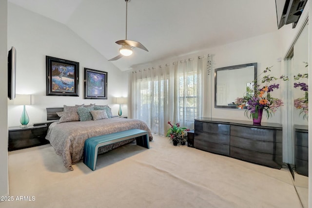 bedroom featuring carpet floors, vaulted ceiling, and ceiling fan