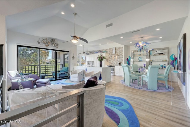 living room featuring ceiling fan, high vaulted ceiling, and light hardwood / wood-style floors