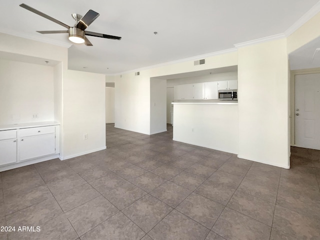 unfurnished room with crown molding and ceiling fan