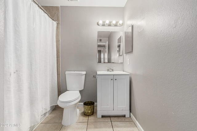 bathroom featuring vanity, toilet, curtained shower, and tile patterned floors