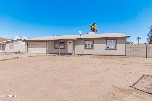 single story home featuring a garage